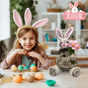 Plush Easter bunny doll in plaid dress holding flowers shown in a festive home setting