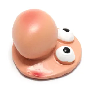 Detailed view of a creative resin figurine face featuring a large nose and frog eyes