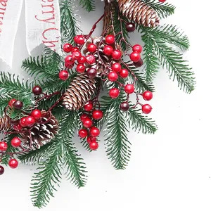PE Christmas wreath with red berries, pine cones and festive ribbon for door decor