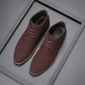 Elegant dark brown suede chukka boots for men featuring pointed toe and lace-up design