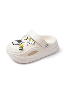 Detailed view of comfortable cream children's clogs featuring cute space astronaut charms