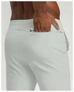 Close-up of men's recycled quick-dry sports pants with a functional zipper pocket