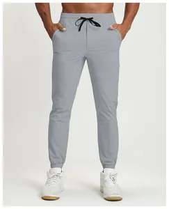 Close-up detail of breathable grey quick-dry men's joggers for outdoor fitness