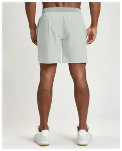 Back view of men's breathable quick-dry sports shorts in light grey for running
