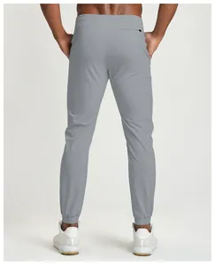 Rear view of men's gray quick-dry athletic joggers with elastic cuffs and zip pocket