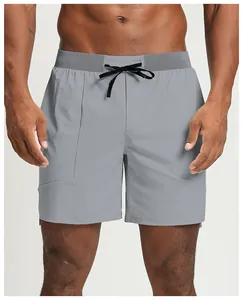 Detail of eco-friendly quick-dry grey men's sports shorts with drawstring waist