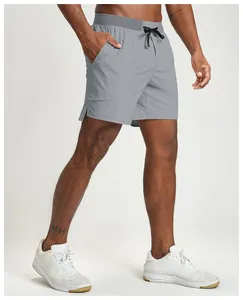 Detail of men's grey quick-dry sports shorts with adjustable drawstring waist