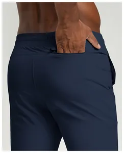 Close-up detail of navy blue men's quick-dry sports pants with a concealed back zipper pocket