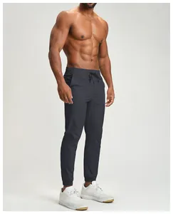 Detailed side view of men's dark grey quick-dry joggers for fitness and sports