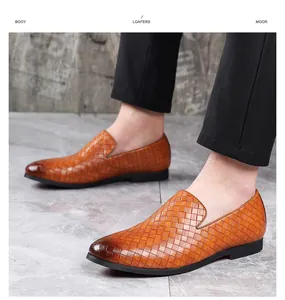 Close-up of tan woven leather slip-on loafers for men in a professional setting