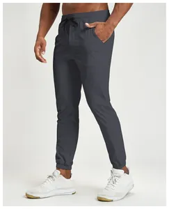 Detail side view of grey quick-dry water-repellent men's joggers with elastic waist
