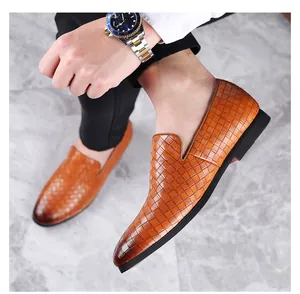 Detailed macro view of brown woven texture men's loafers for stylish business casual wear