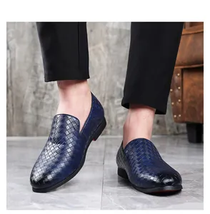 Close-up detail shot of blue woven leather loafers for men in a business casual fashion style