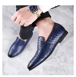 Detailed side view of stylish men's navy blue woven loafers with a classic breathable design
