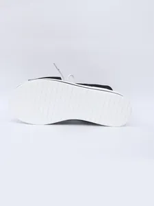 Detailed bottom view of thick white anti-slip sole on platform sandal
