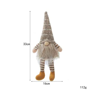 Handcrafted Christmas gnome plush doll with striped legs and pointed hat for holiday decor