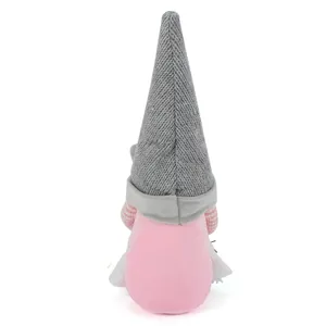 Rear view of a cute plush cat gnome featuring a grey knitted hat and soft pink body