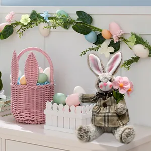 Detailed view of plush Easter bunny doll wearing plaid dress with spring decorations