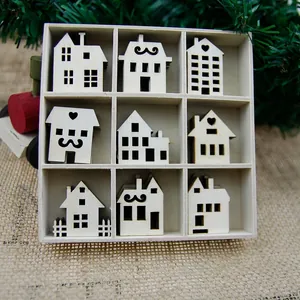 Detailed macro shot of nine different laser-cut wooden miniature house designs in a grid box