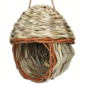 Detailed macro view of a hand-woven straw and wicker bird nest with natural rope.