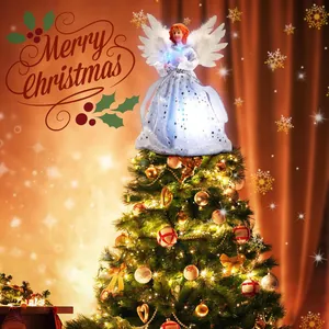 Detailed view of an illuminated angel Christmas tree topper on a glowing tree