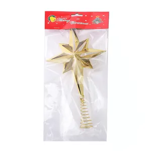 Detailed view of a gold electroplated plastic hollow star Christmas tree topper in packaging