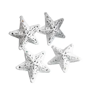 Set of four white glittery hollowed-out star ornaments for Christmas tree decoration