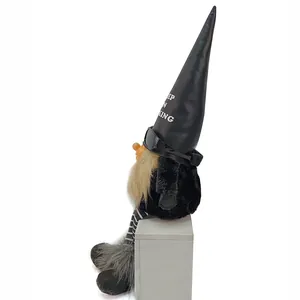 Side view detail of a cool rock style gnome plush with sunglasses and leather hat