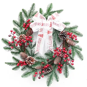 40cm Christmas wreath decoration featuring red berries, pine cones, and a Merry Christmas bow.
