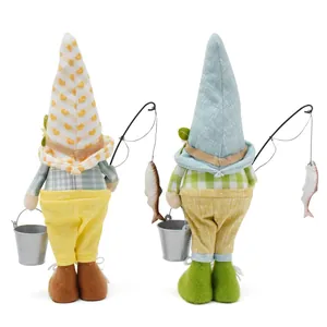 Detailed back view of two fabric fishing gnome figurines with miniature rods and buckets