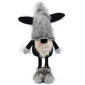 Close-up detail of cute dog gnome plush doll with grey furry hat and bone accessory