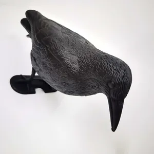 Macro view of a realistic black crow decoy showing detailed feather textures for hunting.