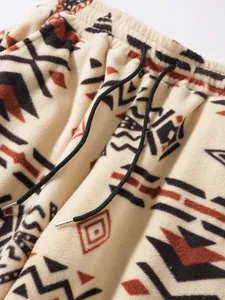 Close-up of winter fleece sweatpants featuring Aztec pattern and drawstring detail
