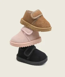 Stack of toddler warm fleece-lined snow boots with soft soles in pink, tan, and black.