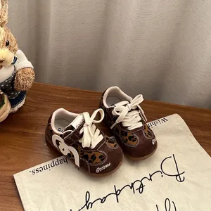 Close-up of leopard print toddler sneakers with soft soles and white laces