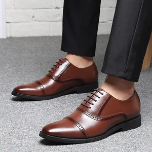 Classic brown leather Oxford dress shoes with elegant brogue detailing for men's formal wear.