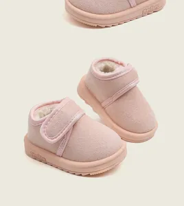 Macro view showing the plush velvet lining and soft sole of these pink baby snow boots