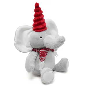 Macro view of elephant plush toy featuring a red spiral hat and patterned scarf
