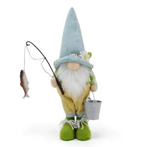 Detailed view of a plush fisherman gnome figurine with rod and silver bucket