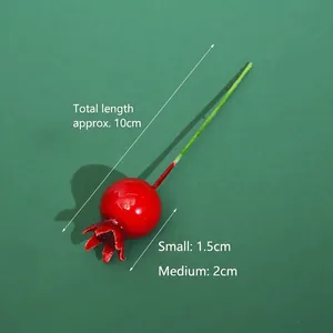 Detailed macro view of red artificial berry cake decoration with size measurements