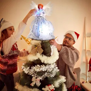 Family placing a beautiful glowing angel tree topper on a festive decorated Christmas tree
