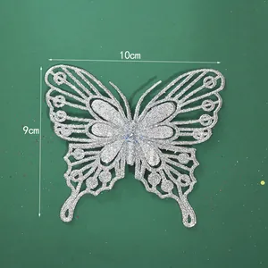 Dettaglio farfalla decorativa glitter argento con indicazioni di 10x9cm.