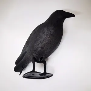 Lifelike black plastic crow decoy with detailed feathers for garden deterrent and hunting