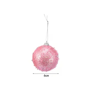 Detailed view of a 6cm pink glitter Christmas ball ornament with sequins and silver string.