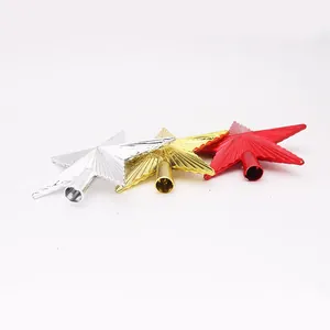 Detailed view of three metallic finish Christmas tree topper stars in gold silver and red