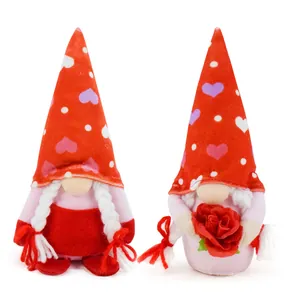 Pair of Valentine gnomes with heart hats, white braids, and a red rose.