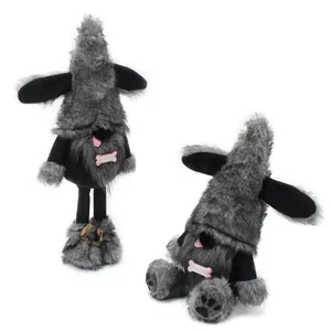 Close-up detail of grey and black dog gnome plush dolls with cute bone accessories