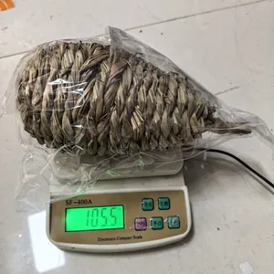 Handmade large straw-woven bird and pet nest weighing 105.5g on a digital scale view