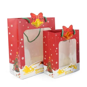 Set of two red Christmas paper gift bags with clear windows and Santa sleigh design