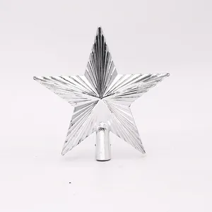 Close-up of a silver ribbed star Christmas tree topper with a metallic finish